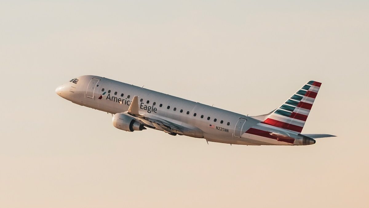 a large passenger jet flying through a cloudy sky