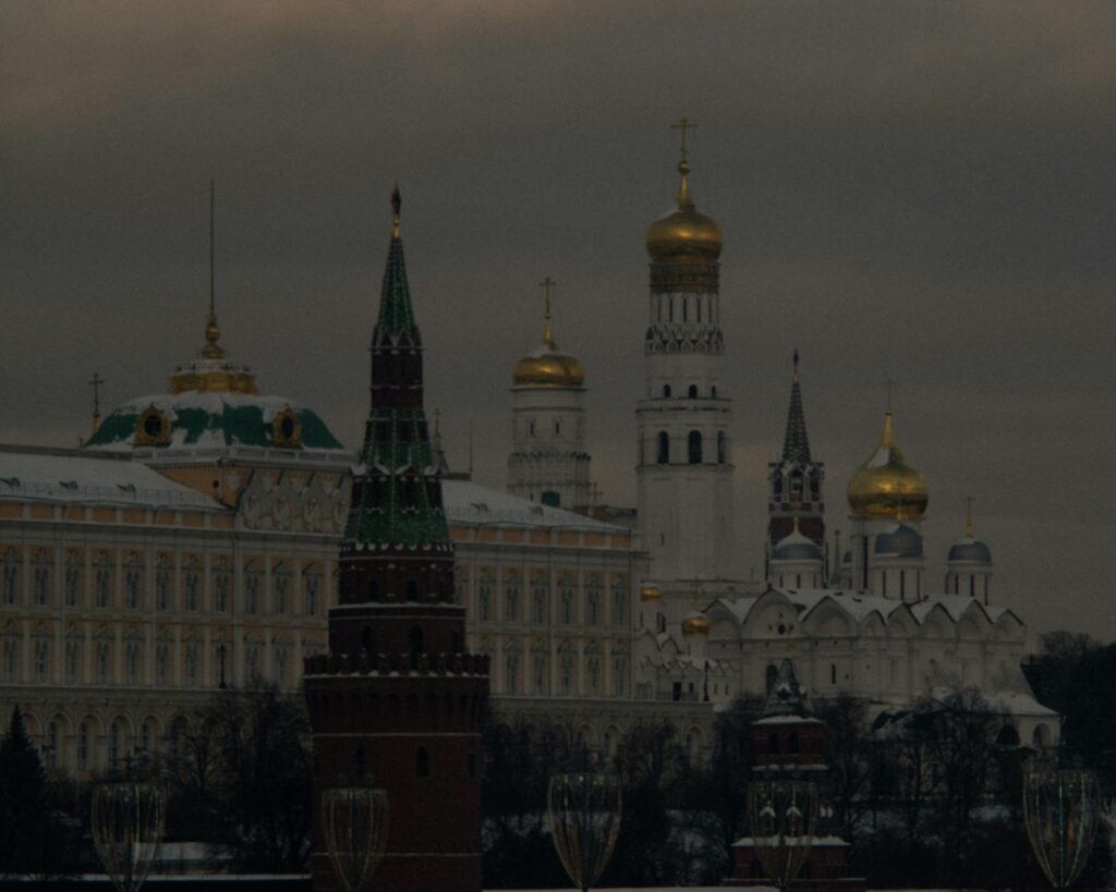 a large building with a clock tower in front of it